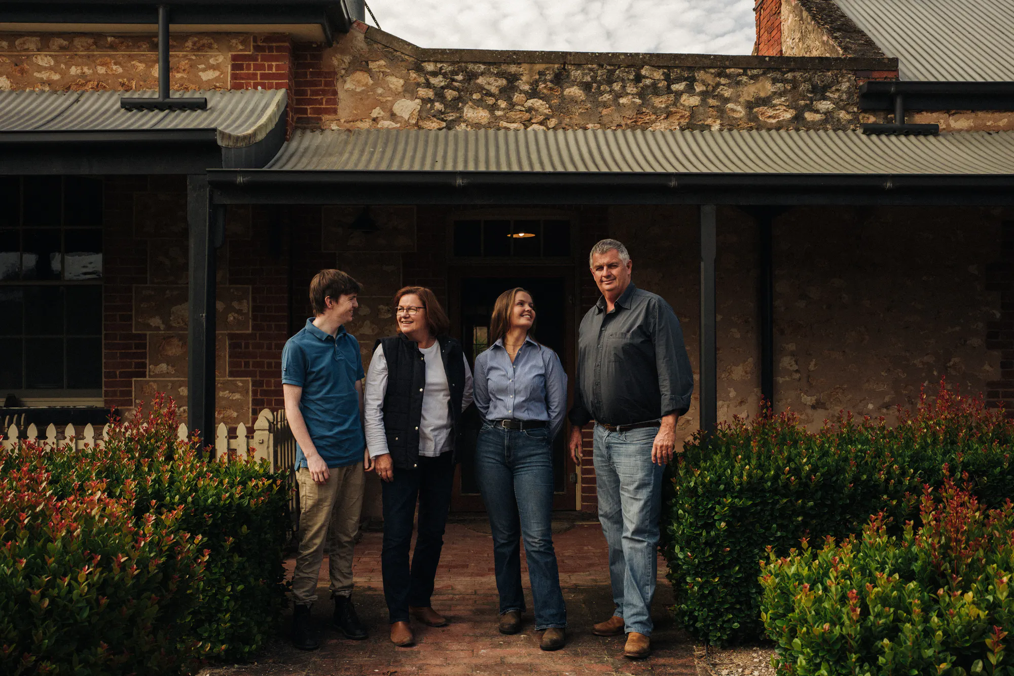 Family photo in front of homestead
